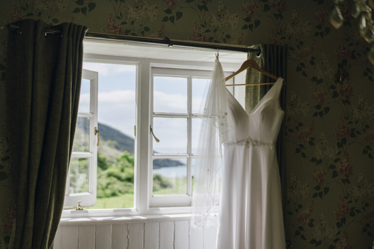 Wedding gown with views of Jennycliff