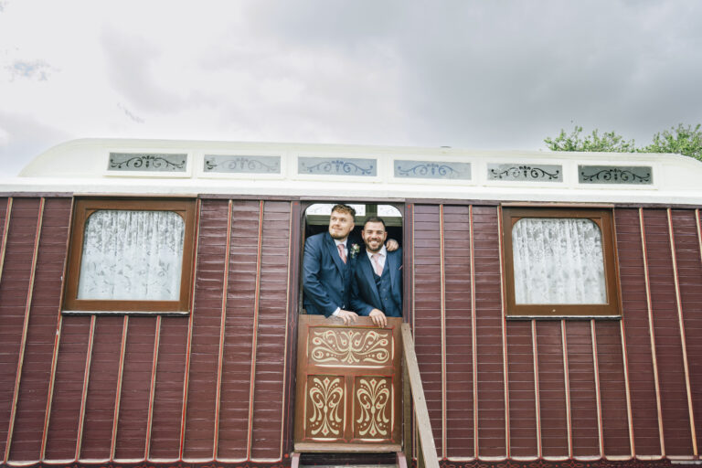 The groom and his best man smiling